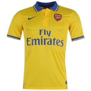 Nike's retro-coloured away jersey for Arsenal in the 2013/14 season was a special one. Note the use of complimentary colours (the shorts were blue and the socks had rings of yellow and blue). PHOTO: World Soccer. 